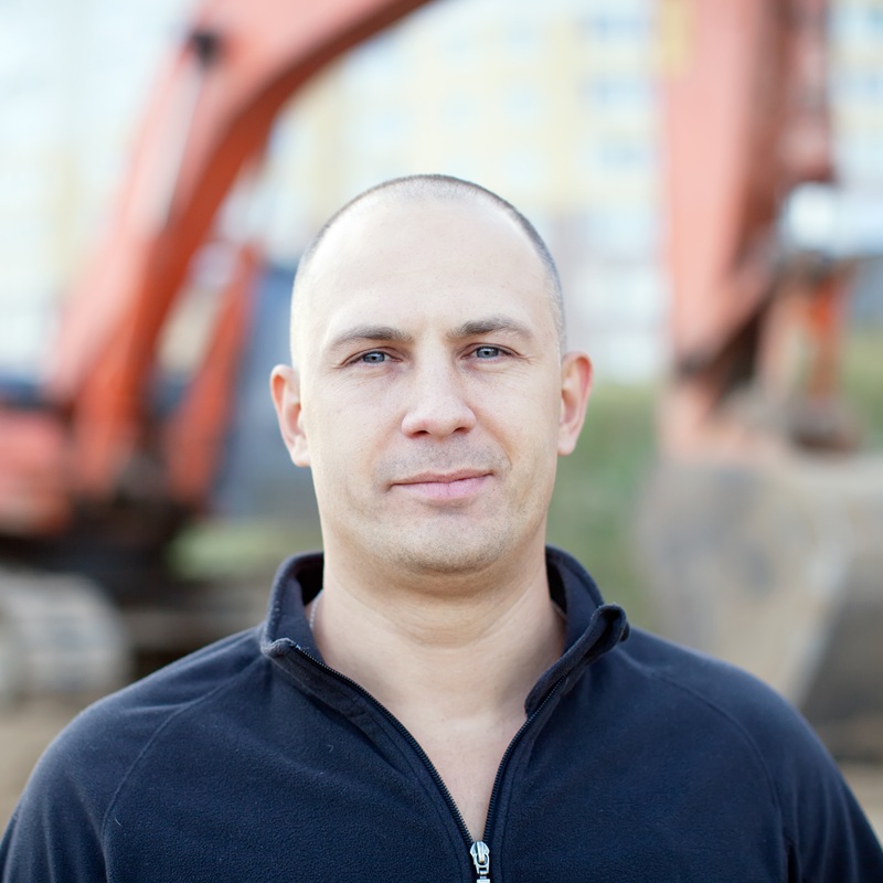 Construction icon showing trowel and tiles